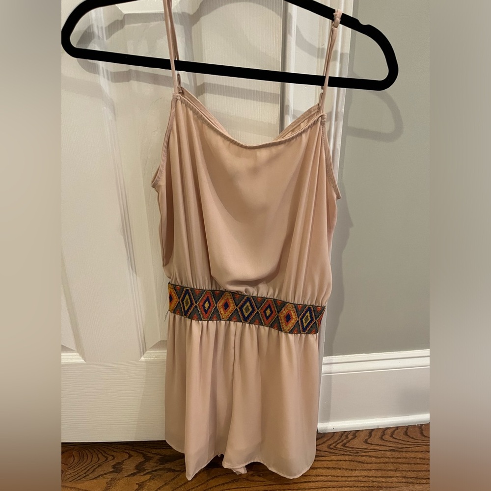 Elegant Beige Sleeveless Romper with Patterned Waist